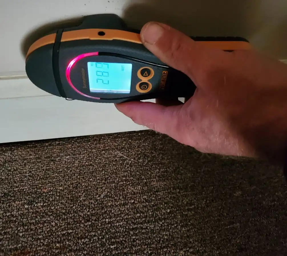 Moisture detection at baseboard during Storm Damage Restoration in Renton